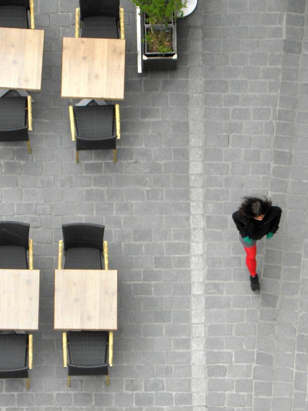 downward view from the watchtower of a lone walker at Tournai in Belgium