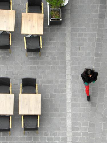 downward view from the watchtower of a lone walker at Tournai in Belgium