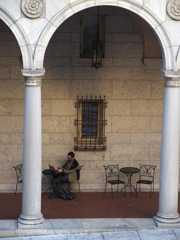 a scholar reading electronically in an alcove at the Boston Public Library