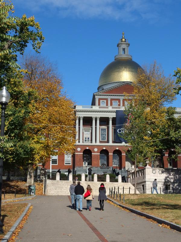 tourists head up the red-brick-path of the Freedom Trail toward the Massachusetts State House in Boston