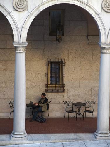 scholar reading electronically in an alcove at the Boston Public Library