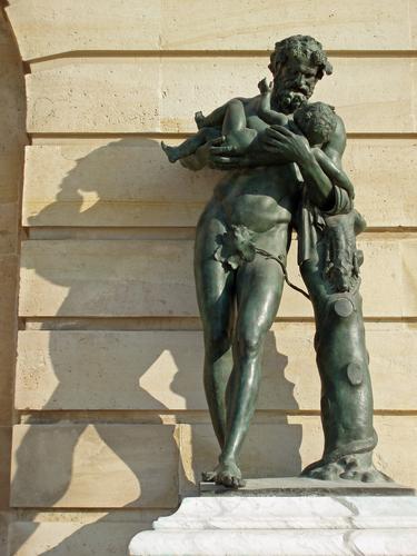 statue of father-and-child outside Versailles near Paris, France