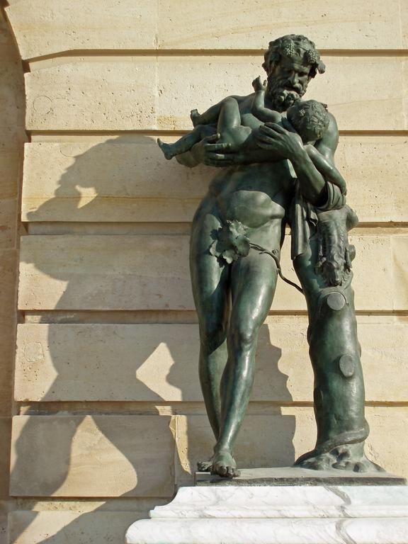 statue of father-and-child outside Versailles near Paris, France