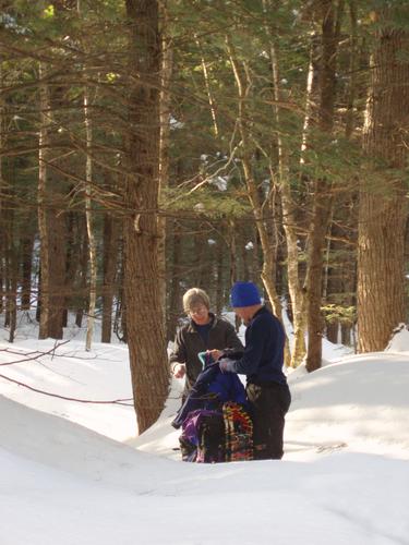 winter hikers in the woods on Big Attitash Mountain in New Hampshire