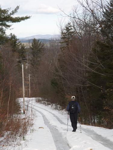 Dick heads down the tower access road from the summit of Barrett Hill in southern New Hampshire