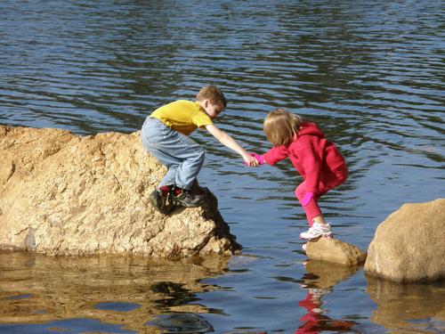 hikers on Bear Hill Pond at Bear Brook State Park in New Hampshire