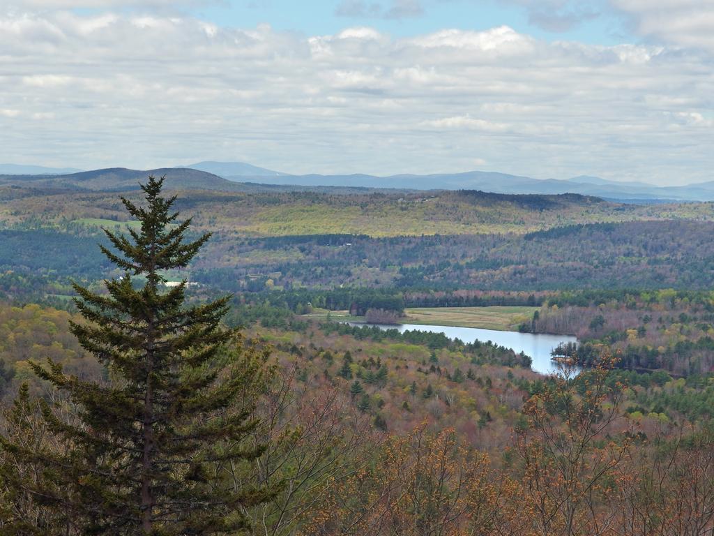 view west in May toward the mountains of Vermont from Blood Mountain in southern New Hampshire