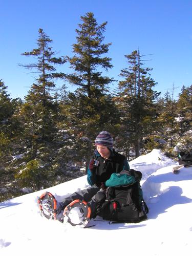 winter hiker on Blueberry Mountain in New Hampshire