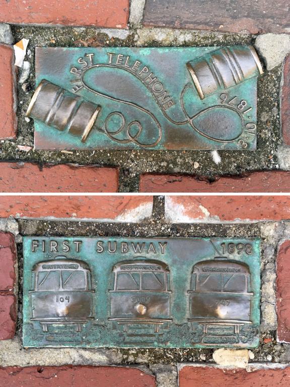 sidewalk bricks advertising Boston historical development near Long Wharf in Massachusetts