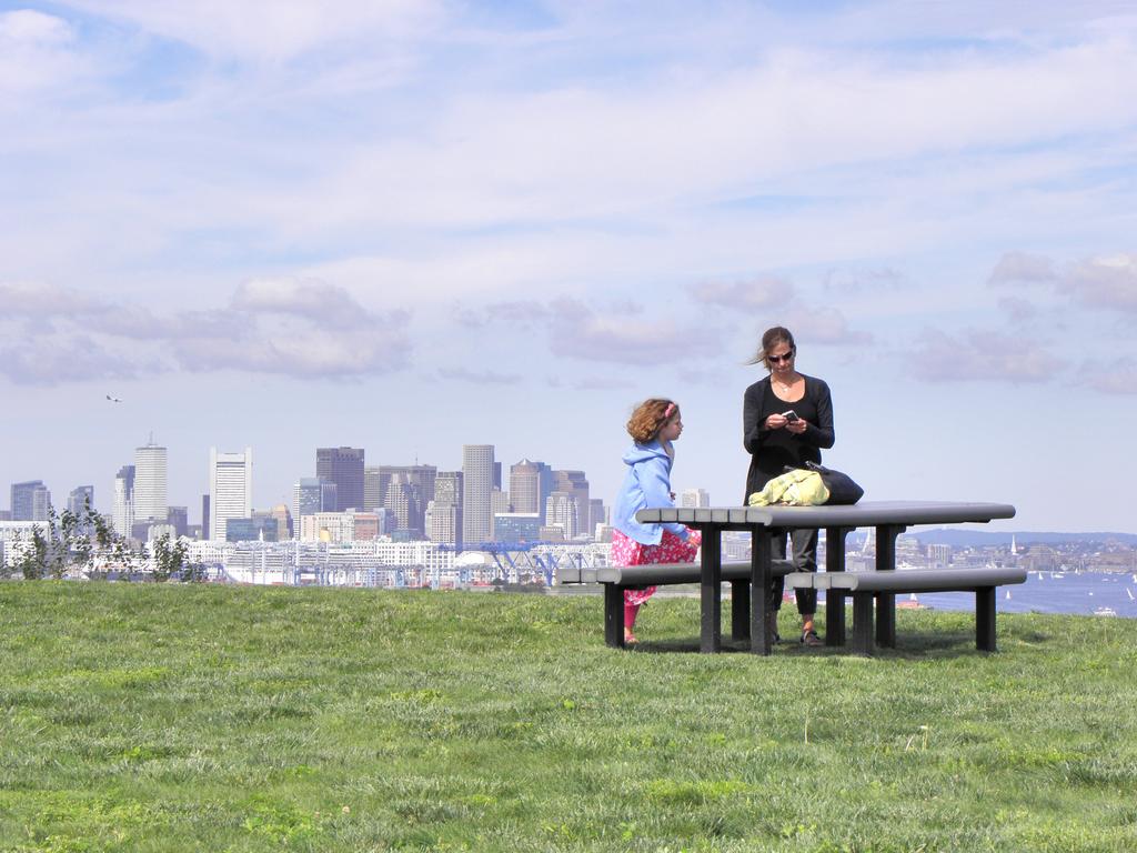 Mia and Kate atop the North Drumlin of Spectacle Island at Boston Harbor in Massachusetts