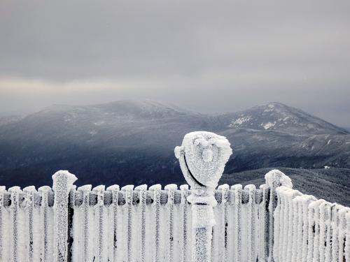 winter hikers at the viewpoint on Cannon Mountain overlooking Franconia Notch in New Hampshire