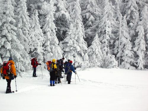 winter hikers on Lonesome Lake in New Hampshire