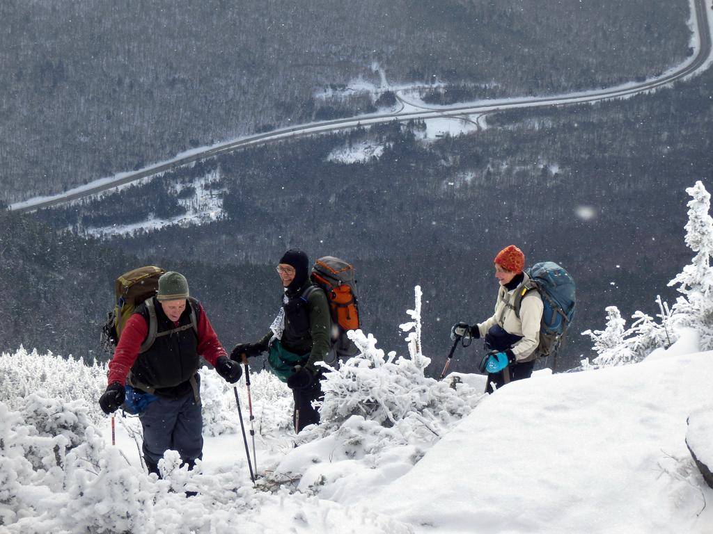 winter hikers near the viewpoint on Cannon Mountain overlooking Franconia Notch in New Hampshire