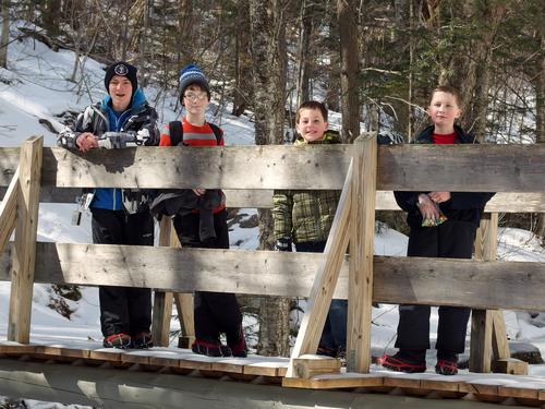 winter hikers on the trail to Mount Cardigan in New Hampshire