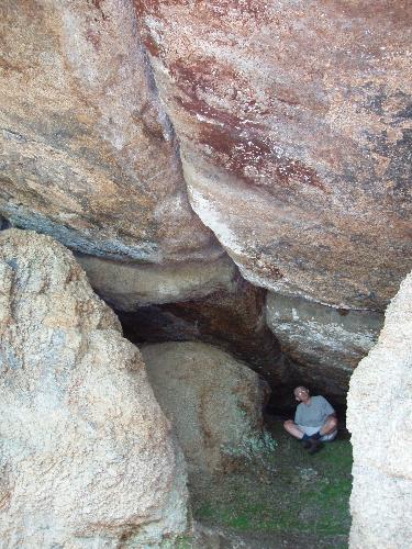 a hiker in the cave on Cave Mountain in New Hampshire