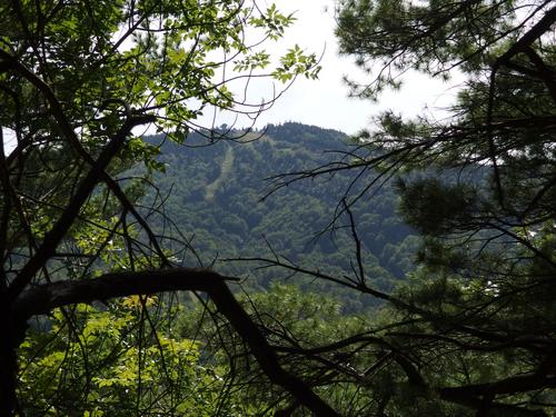 glimpse of Gunstock Mountain from Cobble Mountain in New Hampshire