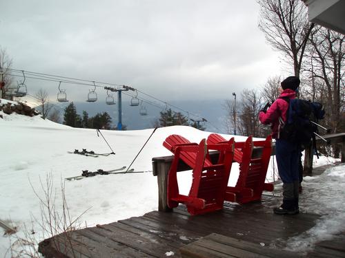 hiker on the summit of Cranmore Mountain in New Hampshire