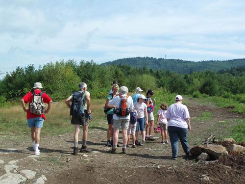 hikers on the trail to Crotched Mountain in New Hampshire