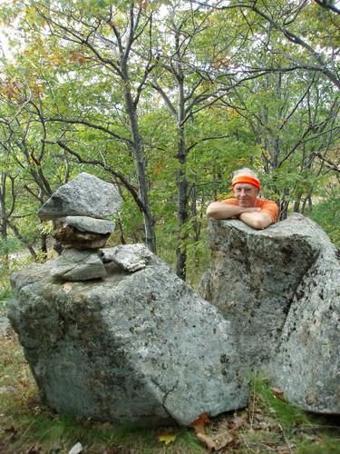 hiker at the summit of Mount Cutler in Maine