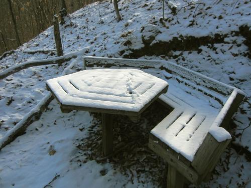 picnic table on the trail through David Dana Forest in northern New Hampshire