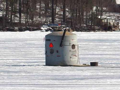 fishing hut in February on Onway Lake at Dearborn Forest in southern New Hampshire