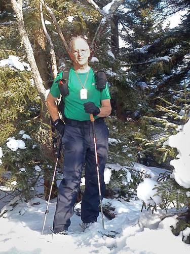 hiker at the summit of Downing Mountain in New Hampshire