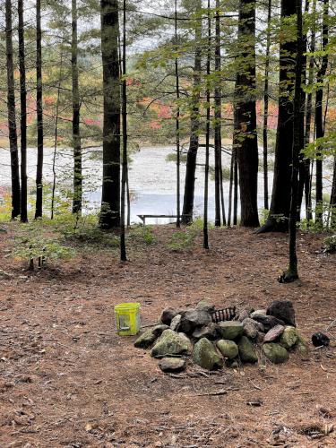 campfire and viewing bench in October at Epsom Town Forest in southern New Hampshire