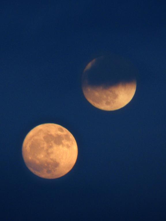 double-exposure moonrise as seen from Federal Hill in New Hampshire