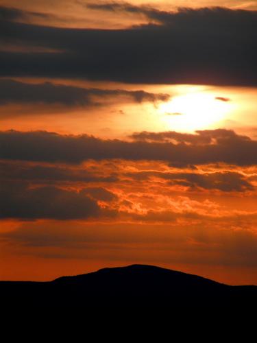 sunset over North Pack Monadnock Mountain as seen from Federal Hill in southern New Hampshire