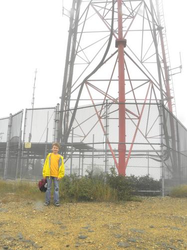 hiker at the summit tower on Fort Mountain in New Hampshire