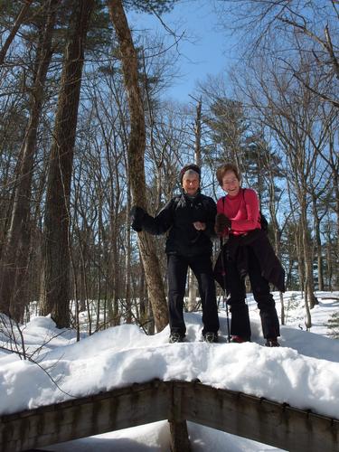 Elaine and Suzanna on a pedestrian bridge at Foster's Pond in New Hampshire