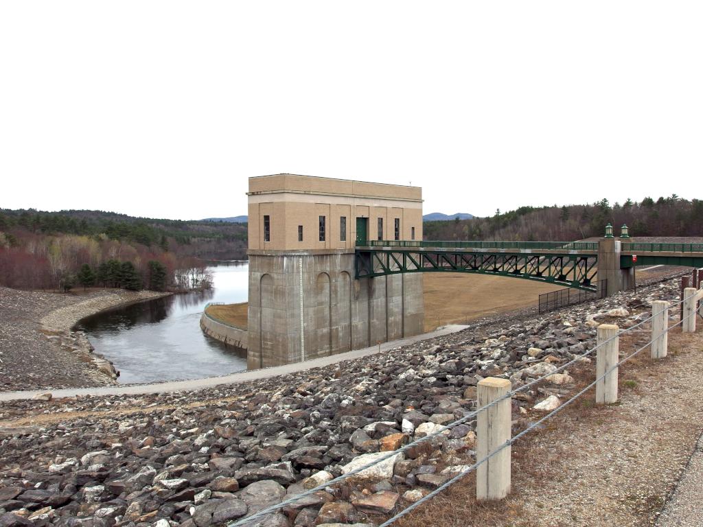 intake tower, access bridge and background reservoir area of Franklin Falls Dam in New Hampshire