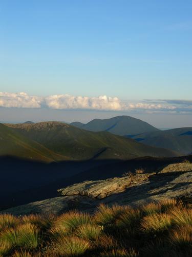 Bondcliff and Mount Carrigain in late-afternoon sunlight as seen from Garfield Ridge in New Hampshire