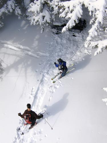 backcountry skiers as seen from the fire tower on Green Mountain in New Hampshire