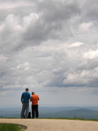 Len and Chuck check the GPS for Geocache locations on the summit of Mount Greylock in Massachusetts