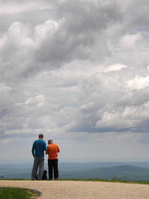 Len and Chuck check the GPS for Geocache locations on the summit of Mount Greylock in Massachusetts