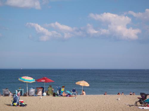 colorful umbrellas in August at Hampton Beach in New Hampshire