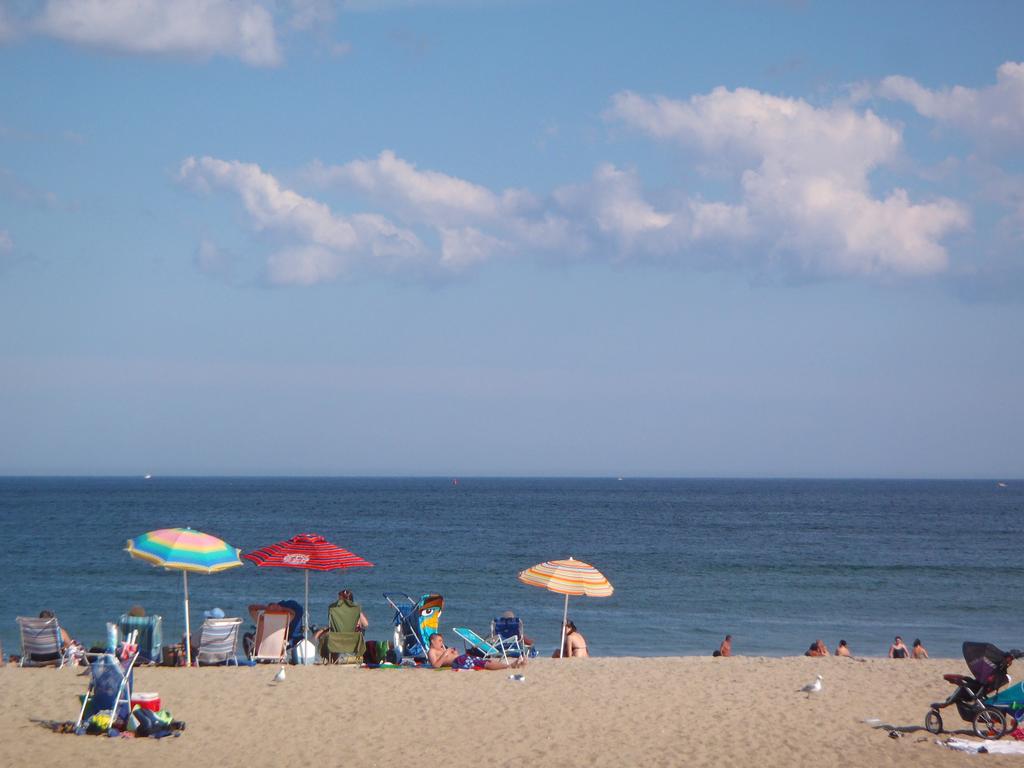 colorful umbrellas in August at Hampton Beach in New Hampshire