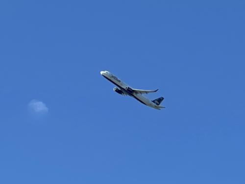 plane in February above Boston Harborwalk in Massachusetts