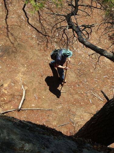 John walks below an impressive vertical cliff on the trail to Hewes Hill at Swanzey in southwestern New Hampshire