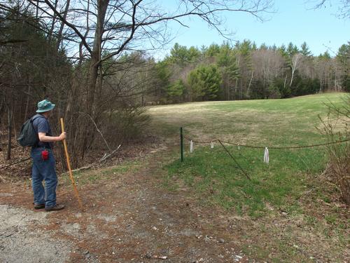 hiker at the start of the trail to Honey Hill at Swanzey in southwestern New Hampshire