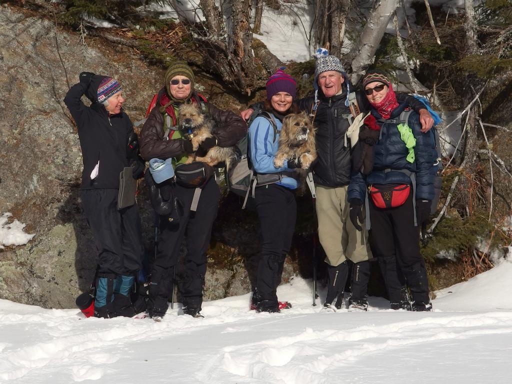 happy hikers on the sunny side of Rays Pond near the summit of Mount Ingalls at Shelburne in New Hampshire