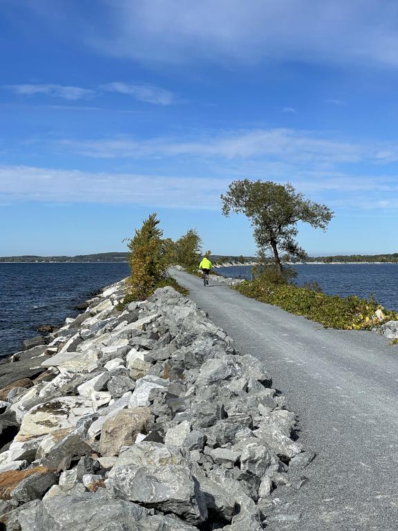 a biker heads out in October on the causeway portion of the Island Line Trail in northwest Vermont