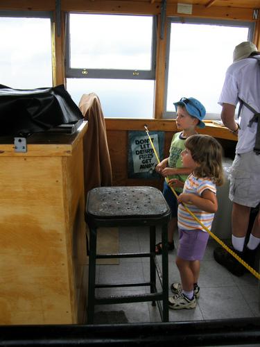 young hikers inside the fire tower on top of Mount Kearsarge in New Hampshire