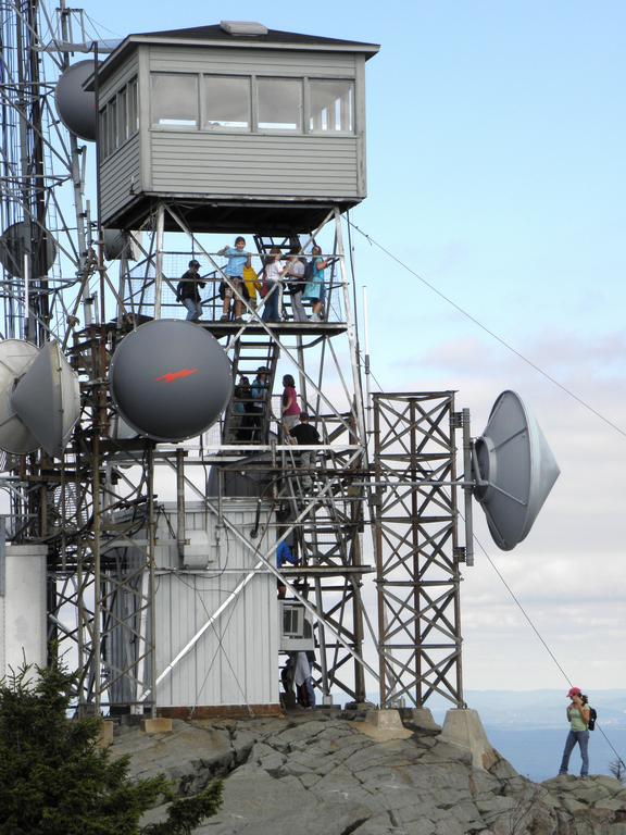 hikers on the fire tower atop Mount Kearsarge in southern New Hampshire