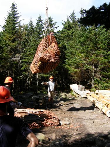 airlifted supplies land at Kinsman Pond Shelter in New Hampshire