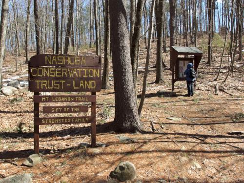 Andee checks the kiosk at the entrance to Mt. Lebanon Property at Pepperell in Massachusetts