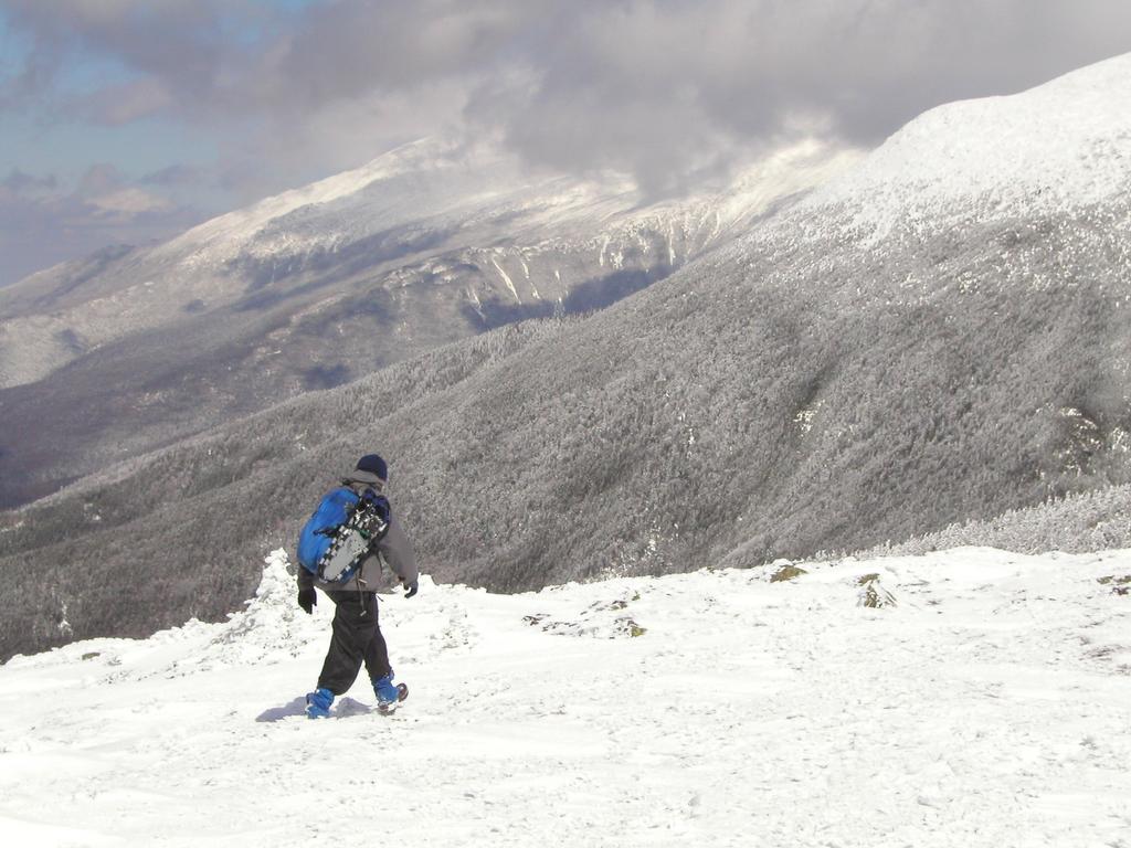 winter hiker on the way from Mount Pierce to Mount Eisenhower in New Hampshire