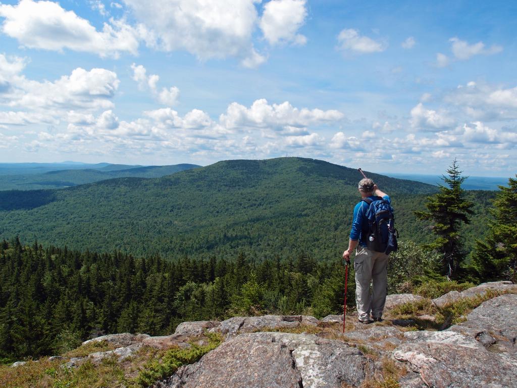 hiker at the cliff viewpoint on North Pack Monadnock Mountain in New Hampshire