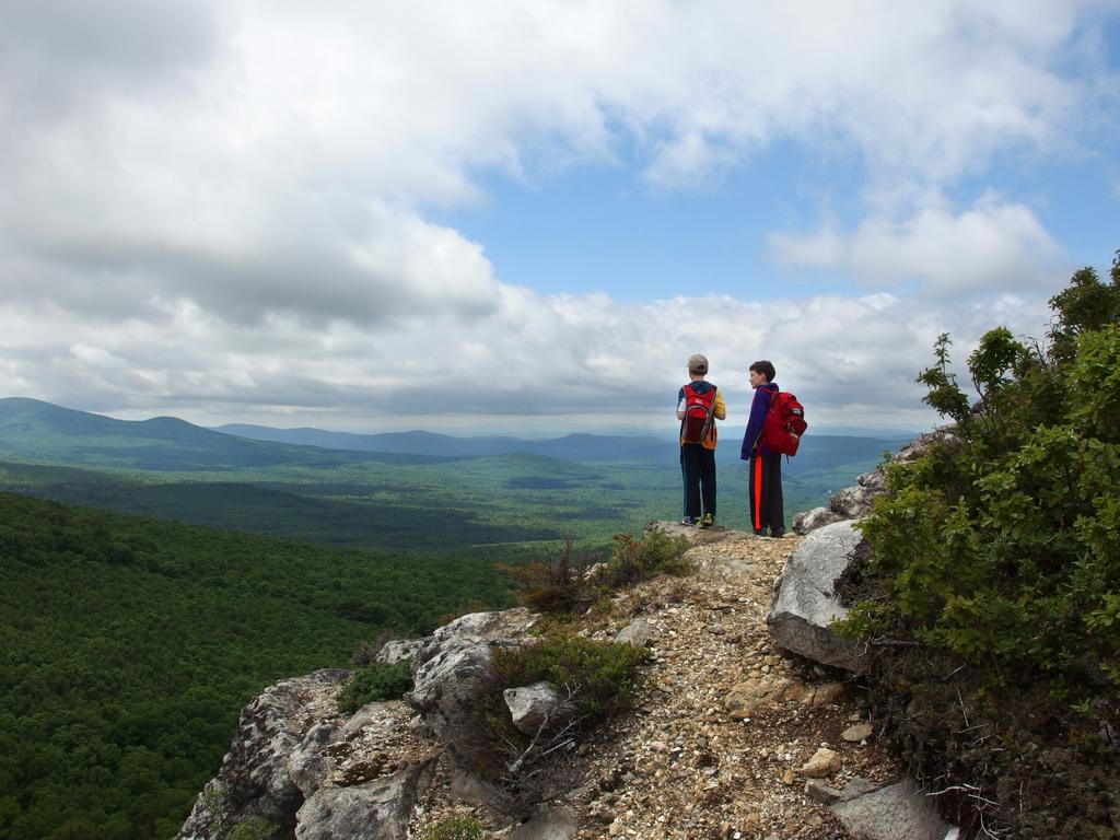 Carl and Ryzek stand out on the edge of The Nubble in the White Mountains of New Hampshire